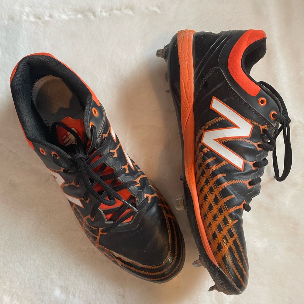 New Balance men’s size 13 Black and Orange baseball metal Cleats